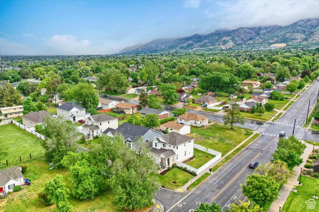 Aerial perspective of suburban area featuring a mountain backdrop