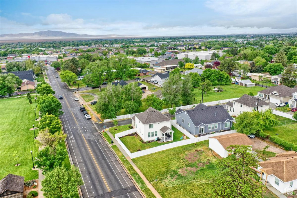 Aerial view of residential area featuring a mountainous background