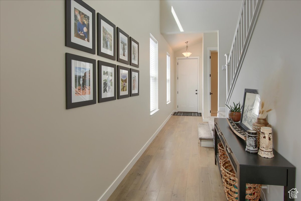 Hall featuring light wood-style floors and baseboards