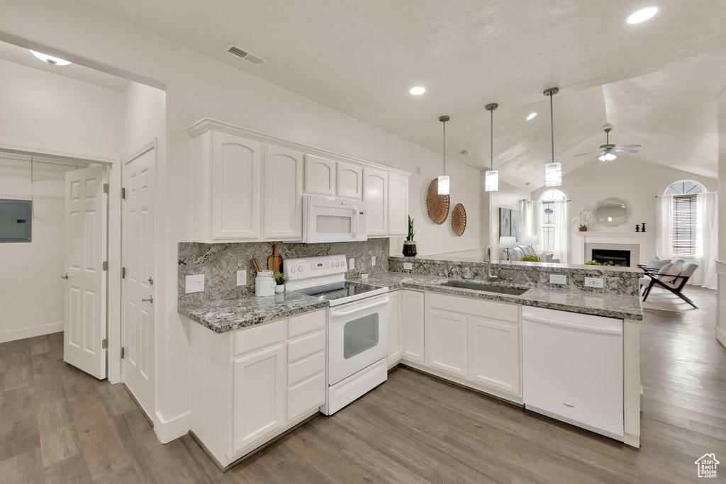 Kitchen featuring white appliances, a sink, ceiling fan, white cabinetry, and backsplash