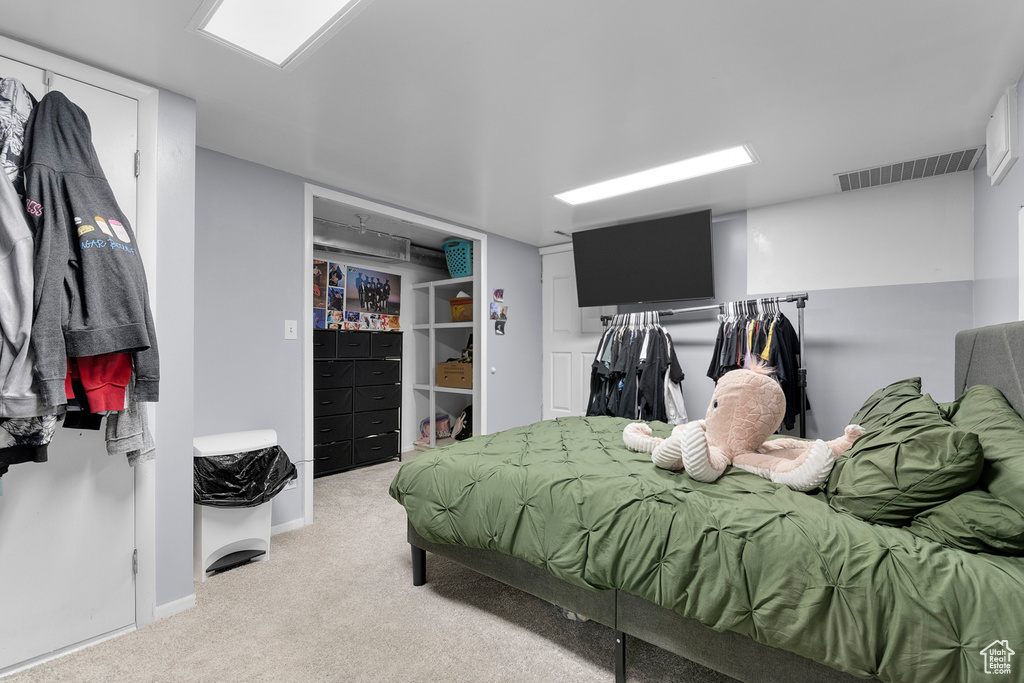 Bedroom with carpet and baseboards