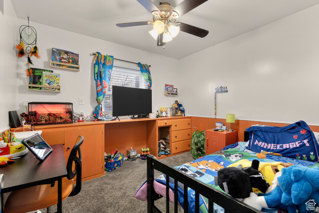 Bedroom featuring carpet, a desk, and ceiling fan