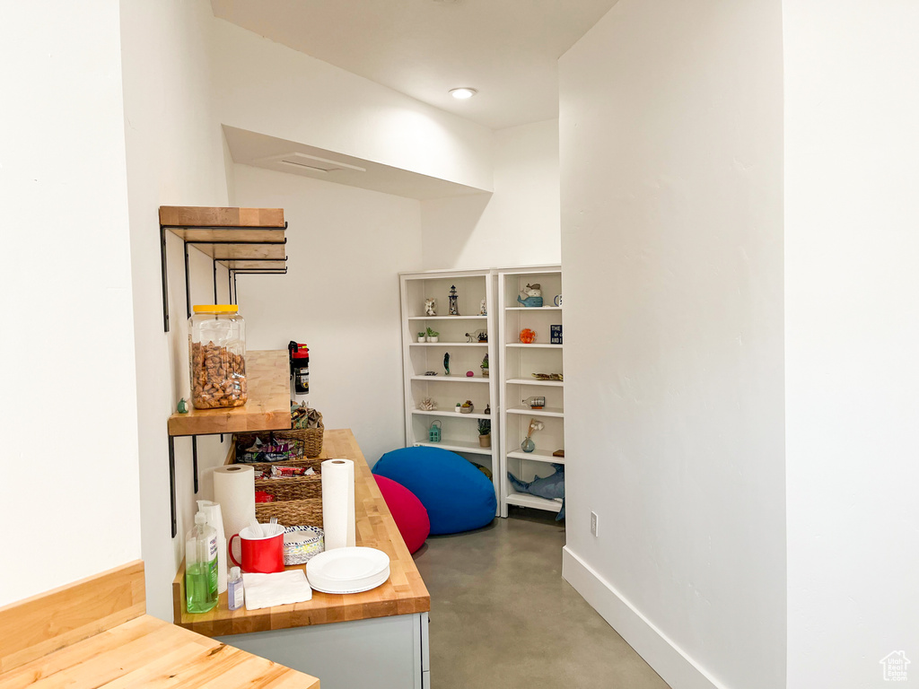 Office featuring concrete floors and baseboards