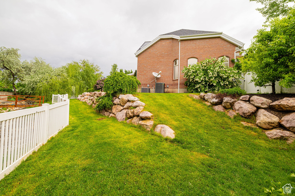 View of yard featuring central AC