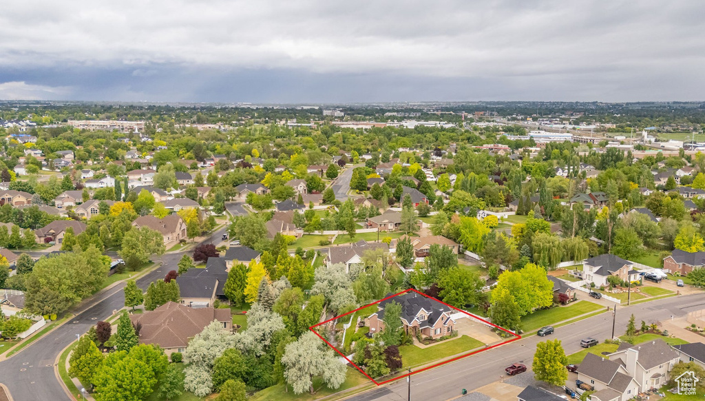 Aerial view of residential area with property parcel outlined