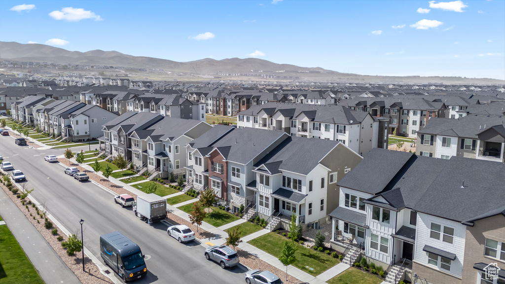Aerial perspective of suburban area featuring a mountain backdrop