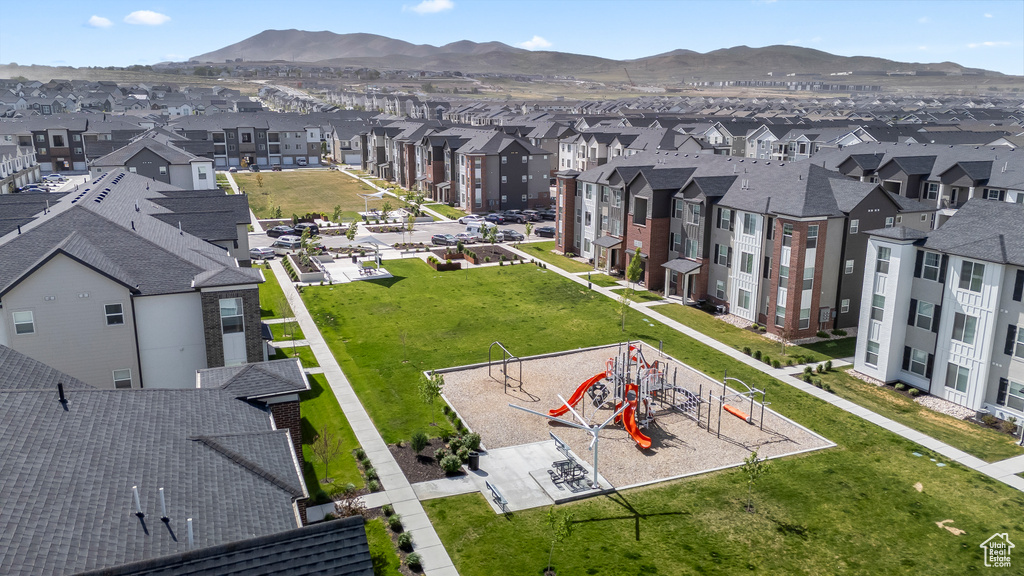 Aerial perspective of suburban area featuring a mountain backdrop