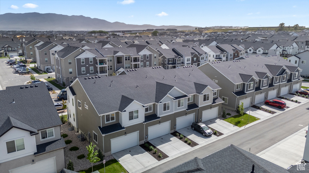 Aerial perspective of suburban area with a mountainous background