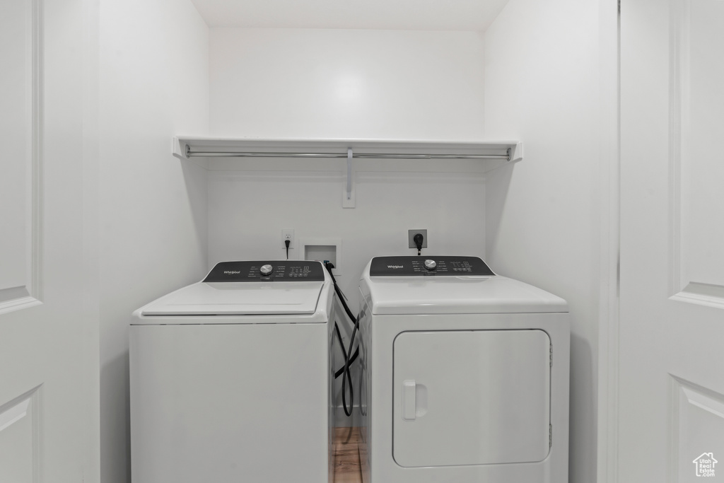 Clothes washing area featuring washer and clothes dryer