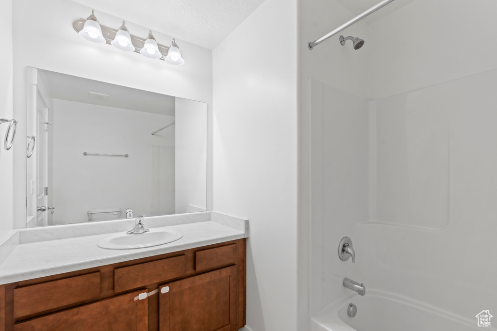 Full bath with washtub / shower combination and vanity