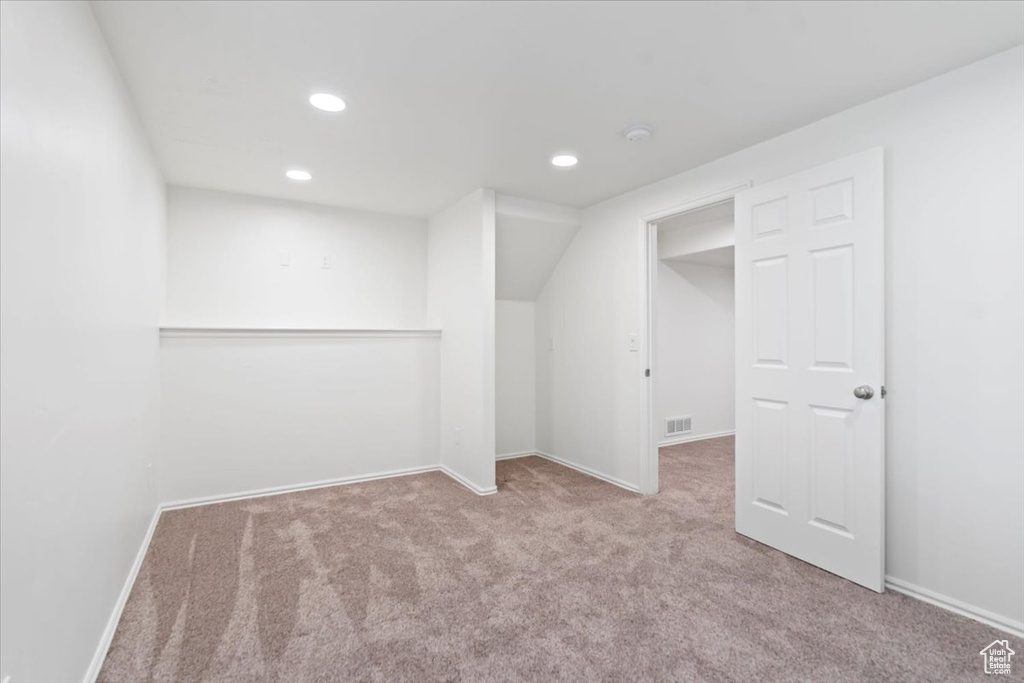 Bonus room with carpet flooring, recessed lighting, and baseboards