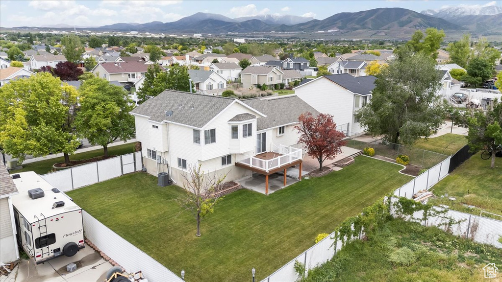 Aerial perspective of suburban area with a mountain backdrop