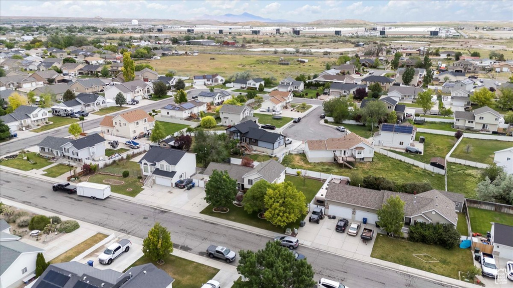 Aerial view of property\'s location with nearby suburban area