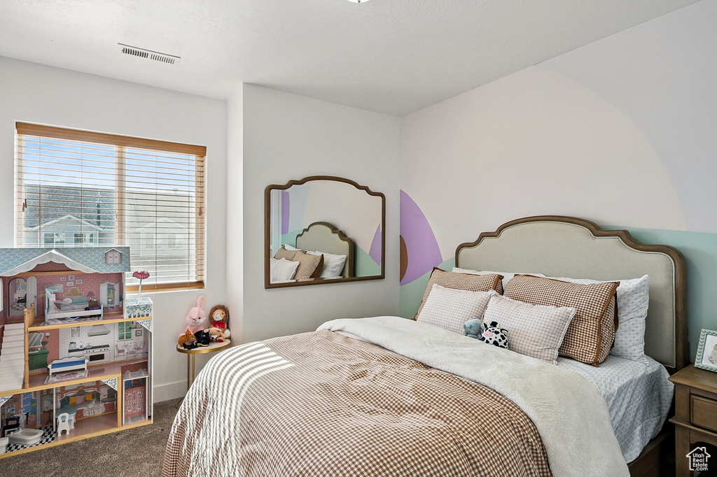 Carpeted bedroom with baseboards