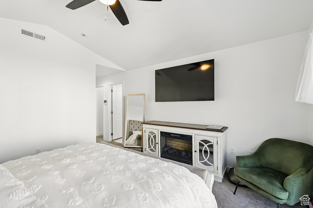 Bedroom with lofted ceiling and ceiling fan