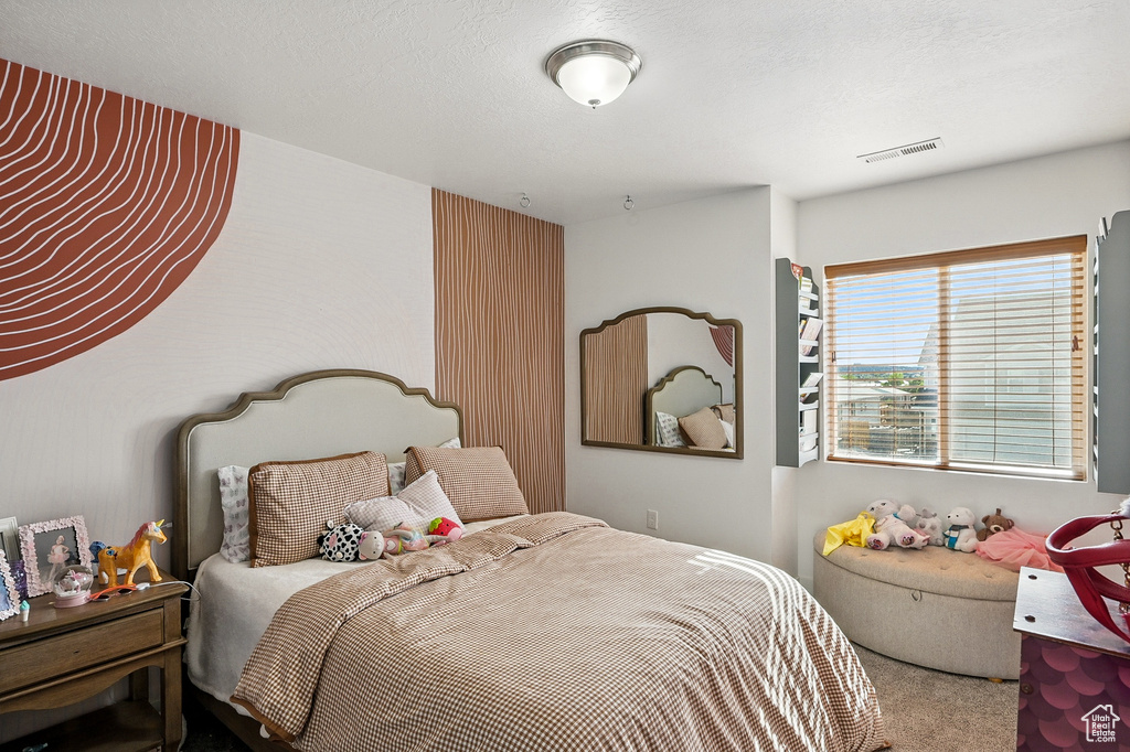 Bedroom featuring carpet