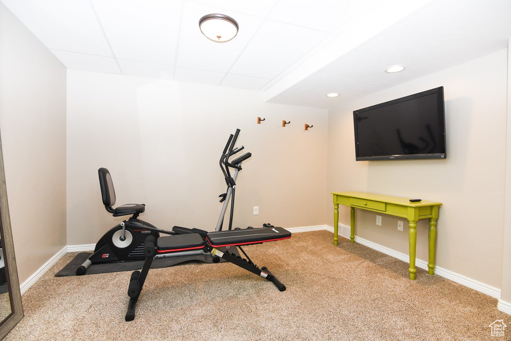 Exercise room featuring carpet floors, baseboards, and recessed lighting