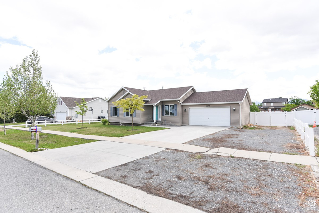 Ranch-style house featuring an attached garage and driveway