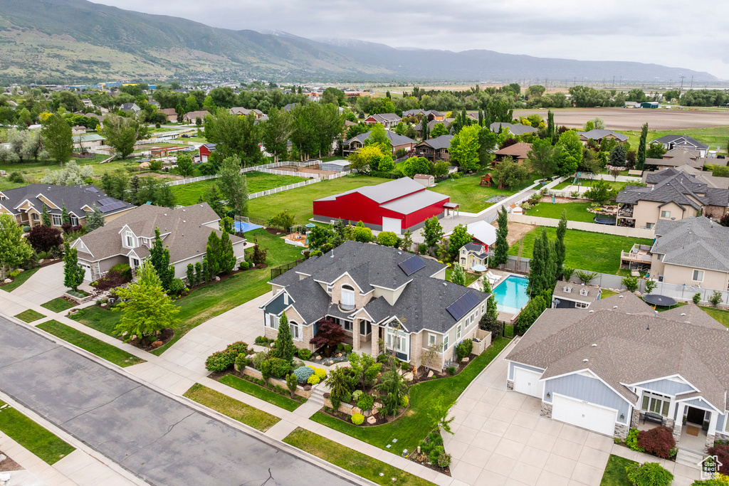 Aerial perspective of suburban area featuring a mountain backdrop