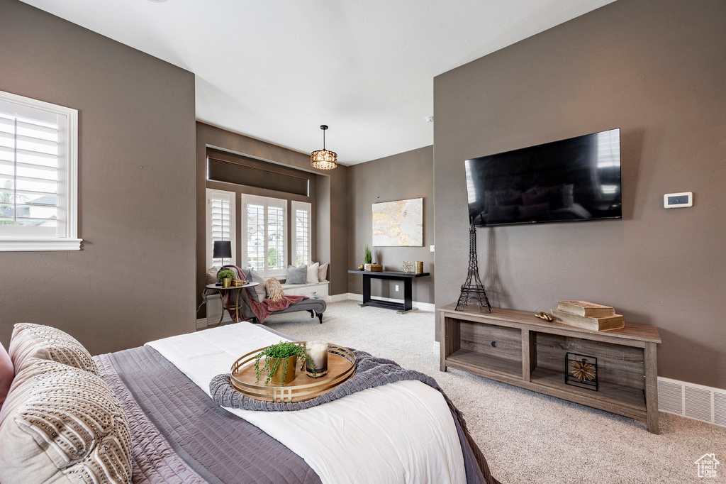 Carpeted bedroom with baseboards