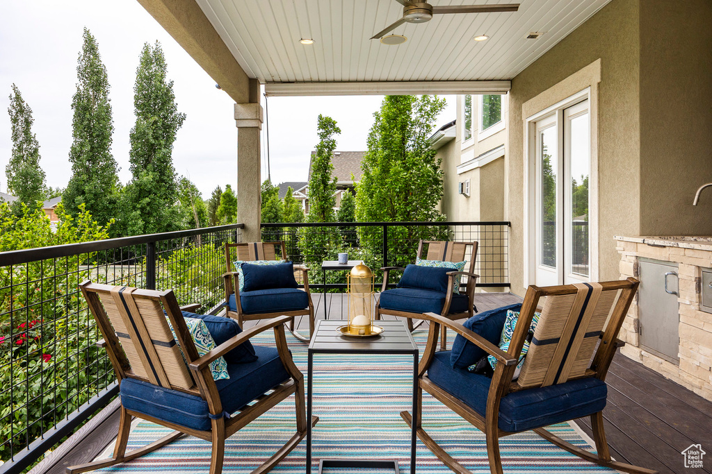 Wooden deck featuring ceiling fan