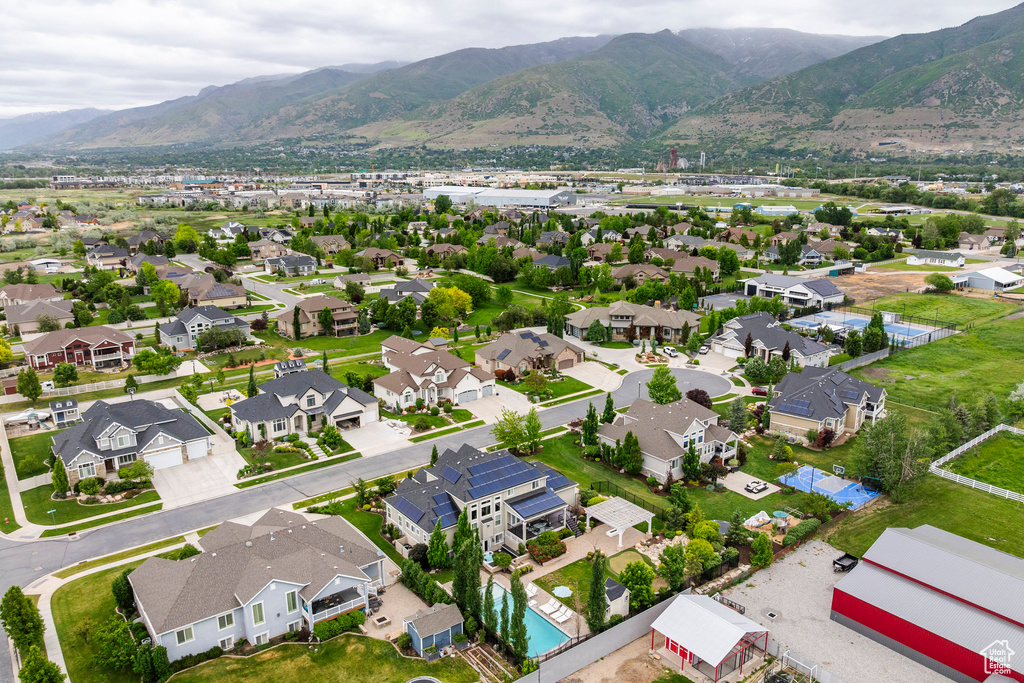 Aerial view of residential area featuring a mountainous background