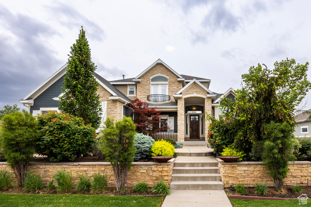 Craftsman-style home with stone siding