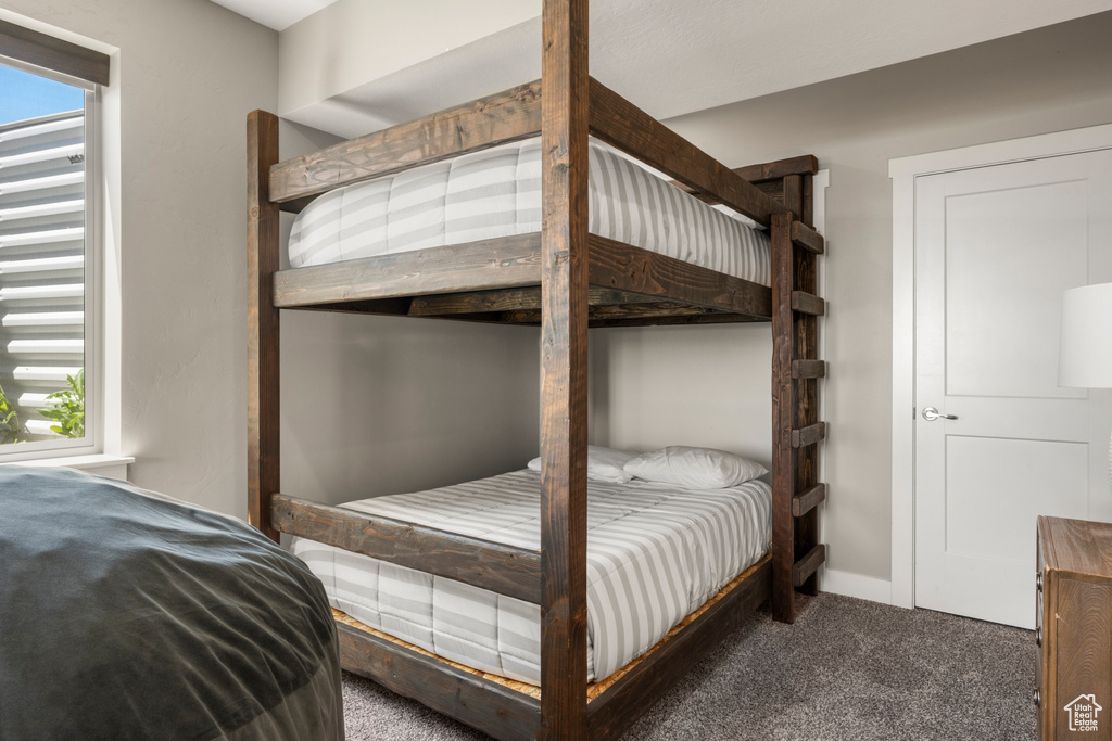 Carpeted bedroom with baseboards