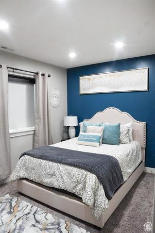 Bedroom with carpet floors, recessed lighting, and baseboards