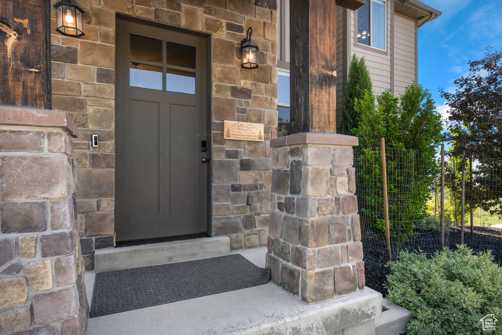 Property entrance with stone siding