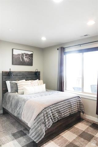 Bedroom featuring baseboards and recessed lighting