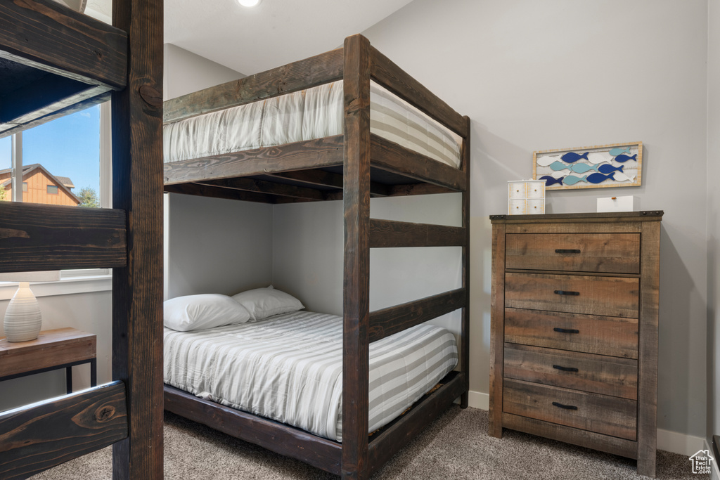 Carpeted bedroom with baseboards