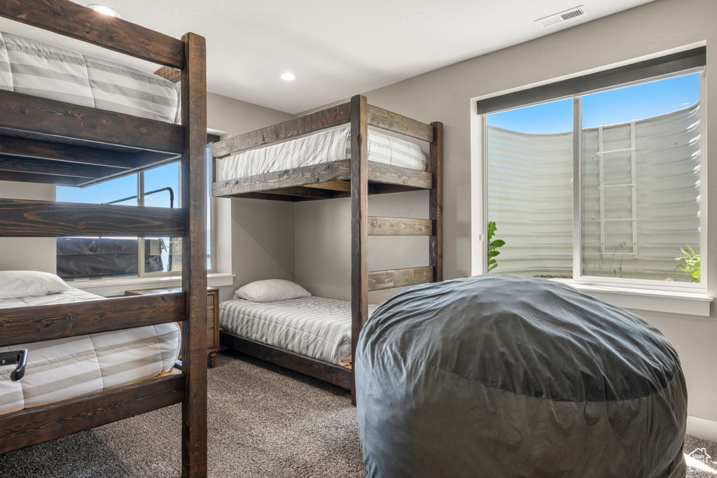 Carpeted bedroom featuring recessed lighting