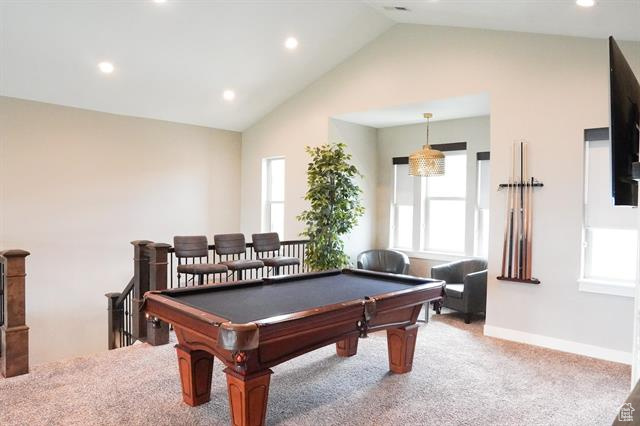 Playroom featuring vaulted ceiling, light colored carpet, recessed lighting, billiards table, and baseboards