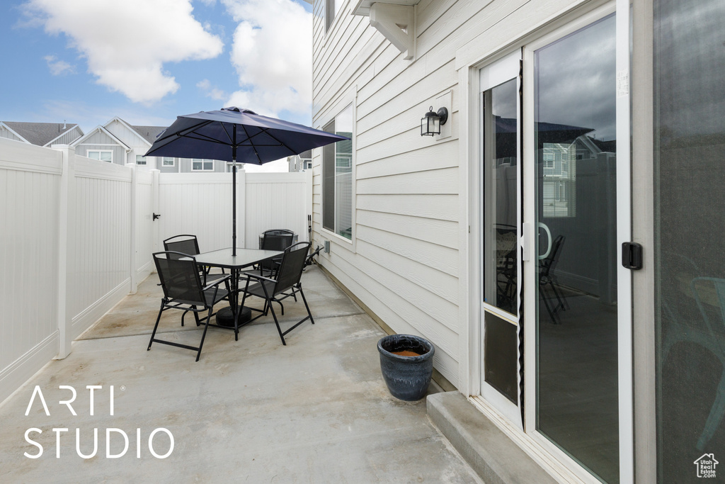 View of patio / terrace featuring outdoor dining area and fence