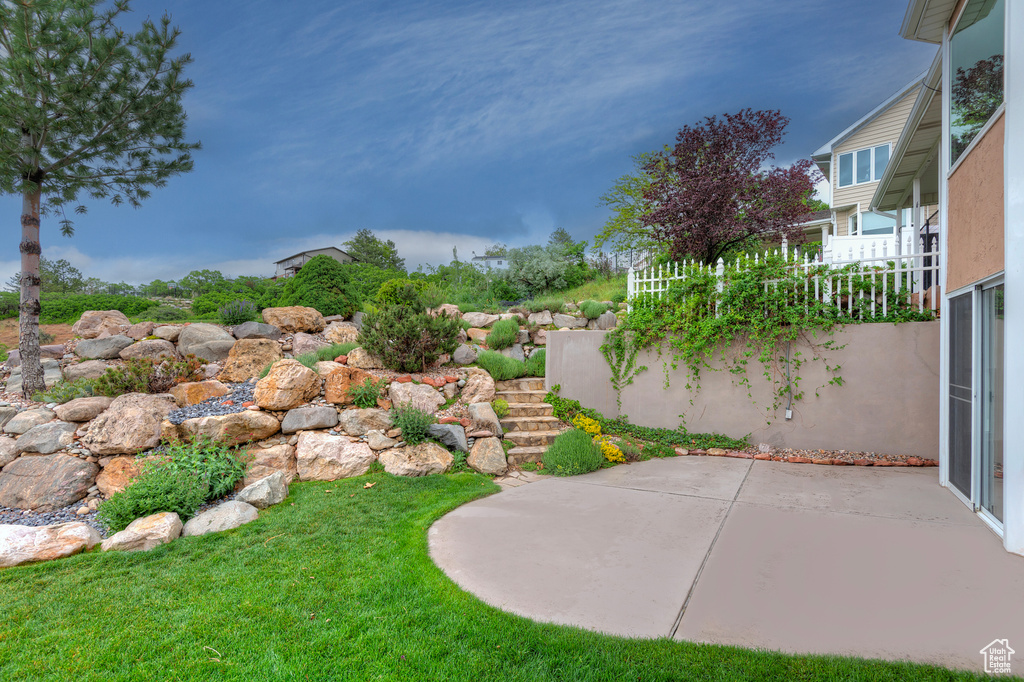 View of yard featuring a patio area and stairway