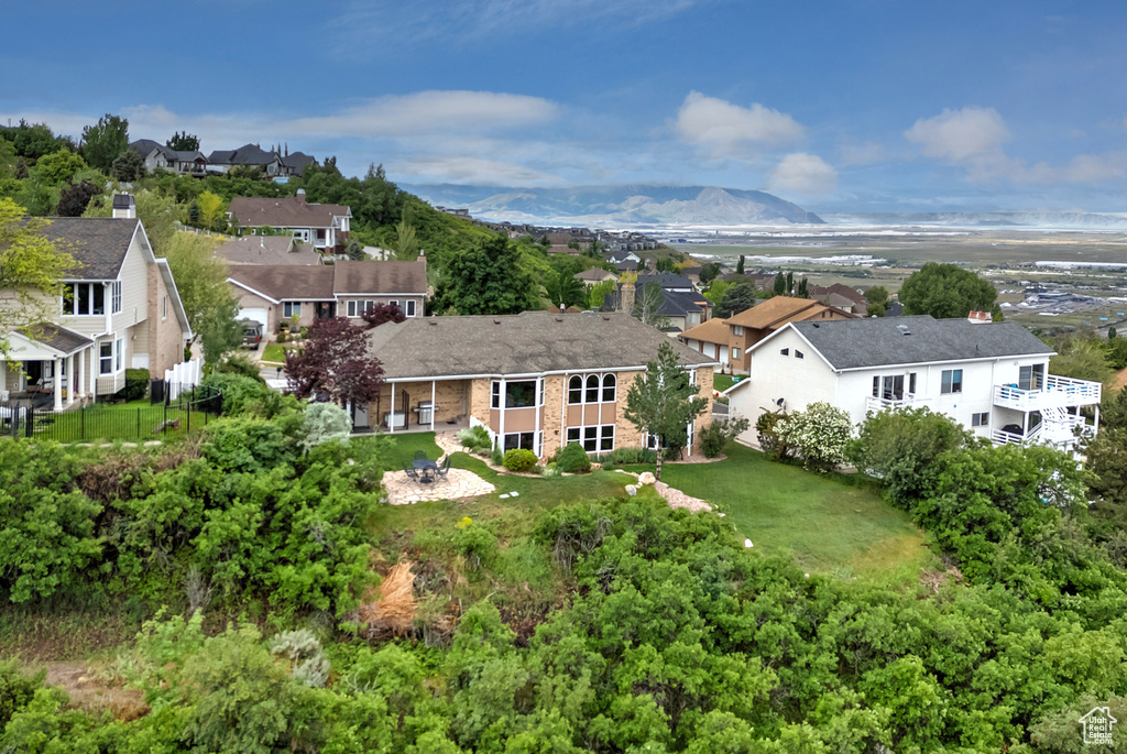 Aerial perspective of suburban area featuring a mountainous background