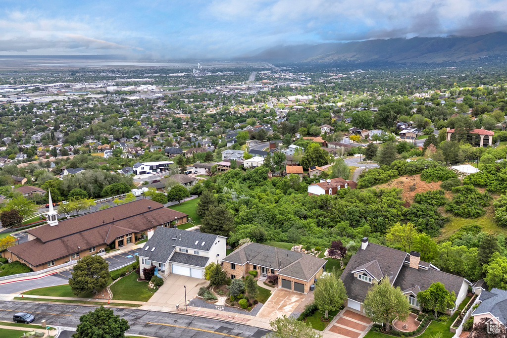Aerial perspective of suburban area featuring a mountain backdrop