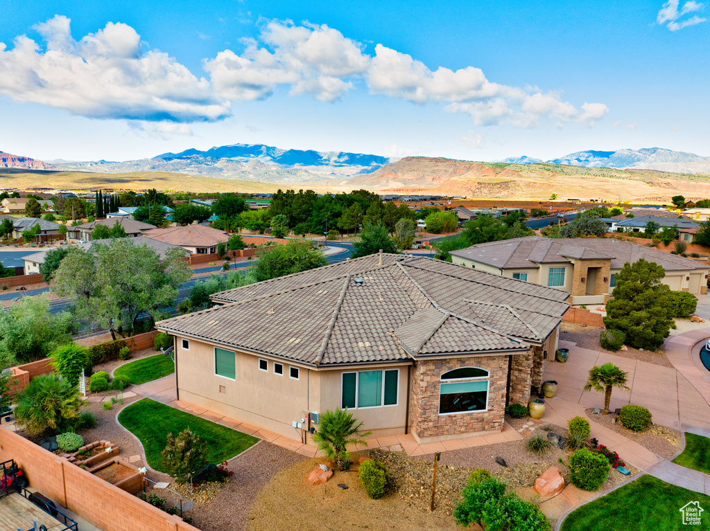 Aerial view of residential area featuring a mountainous background