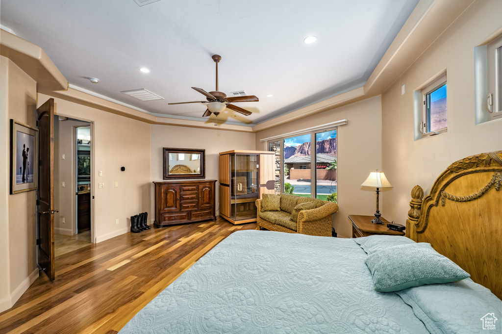 Bedroom with wood finished floors, recessed lighting, baseboards, and a ceiling fan