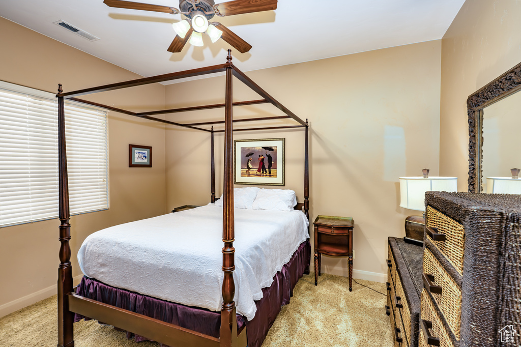 Bedroom featuring carpet floors and baseboards