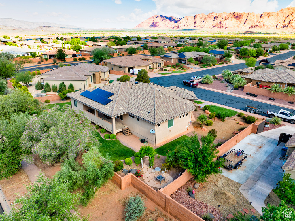 Aerial perspective of suburban area with a mountain backdrop