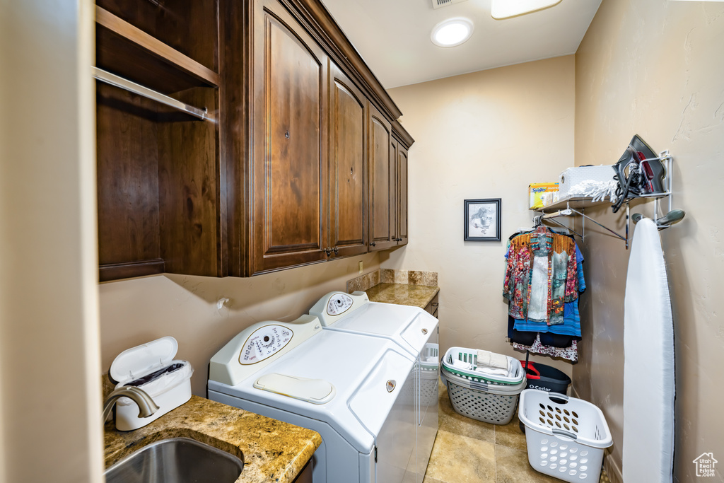 Clothes washing area with washing machine and dryer and cabinet space