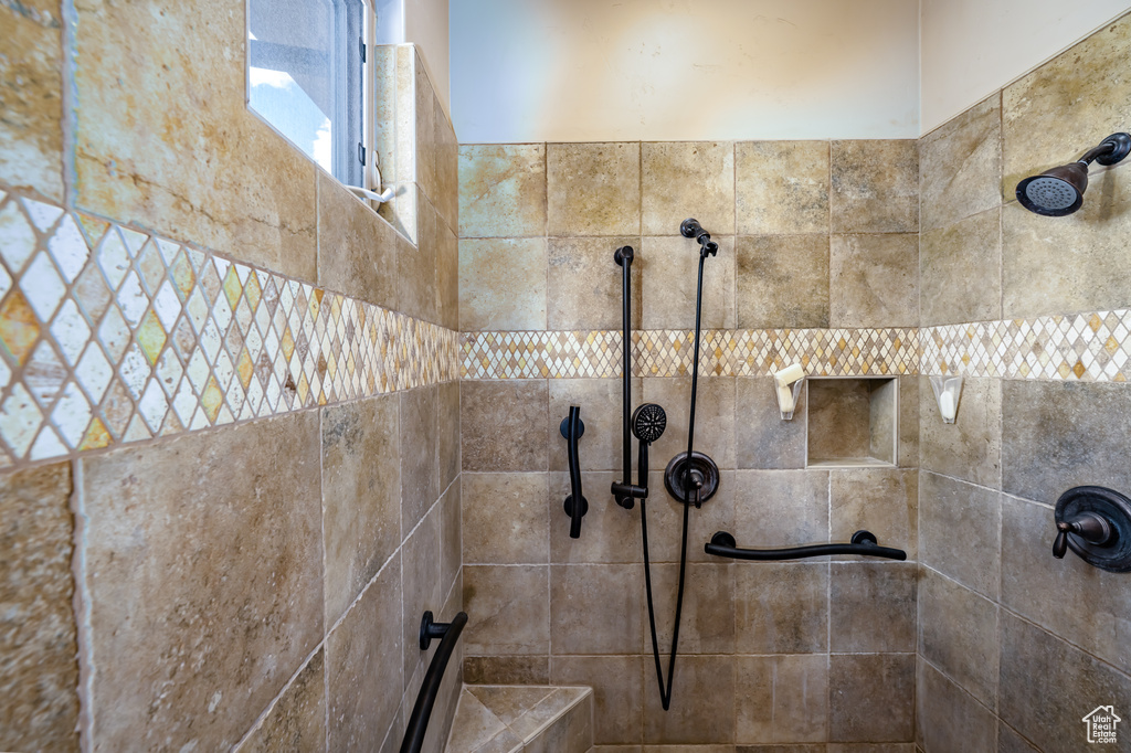 Full bath with tiled shower