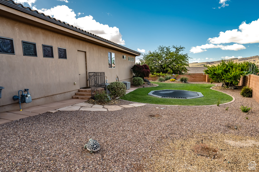 View of yard with cooling unit
