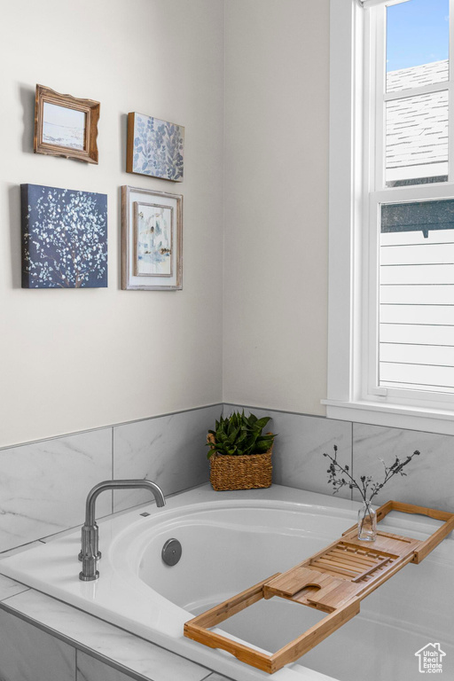 Full bath featuring a bath