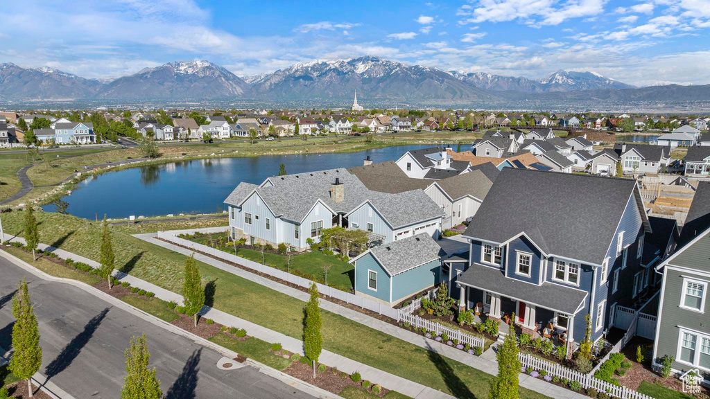 Aerial perspective of suburban area featuring a water and mountain view