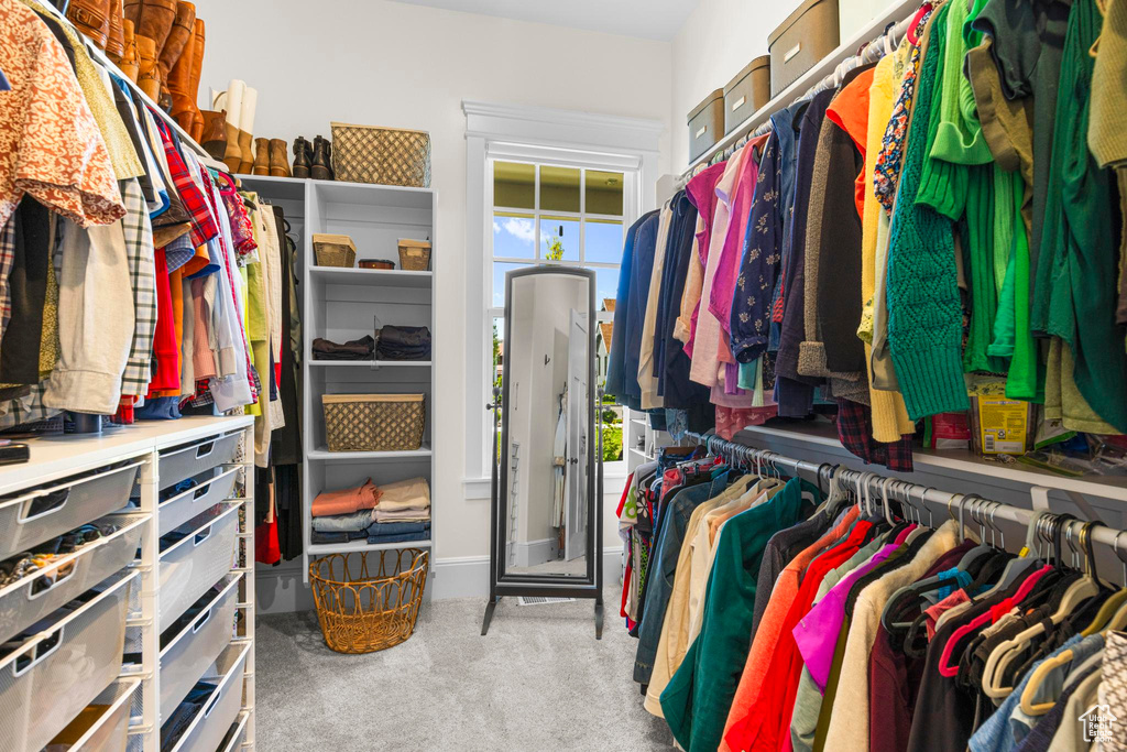 Walk in closet featuring carpet flooring