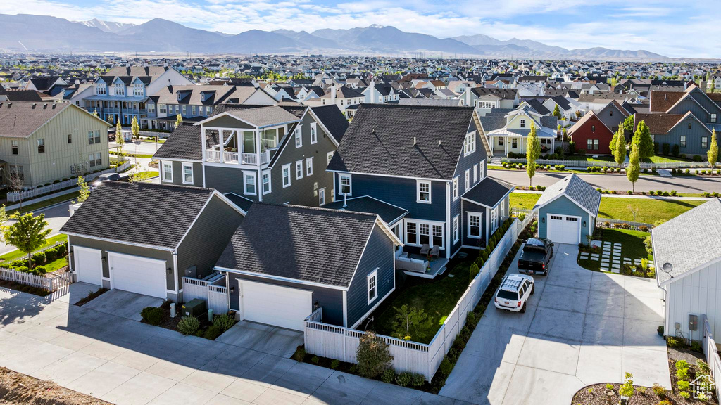 Aerial view of residential area with a mountainous background