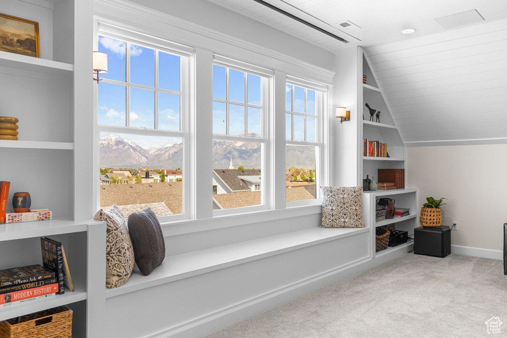 Additional living space featuring vaulted ceiling, carpet floors, a mountain view, wooden ceiling, and baseboards